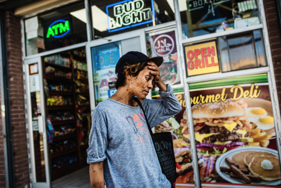 Jackie outside of a bodega in the Bronx after shooting heroin. Her friend, Kelly, stayed with her for approximately thirty minutes to make sure she was safe while high.