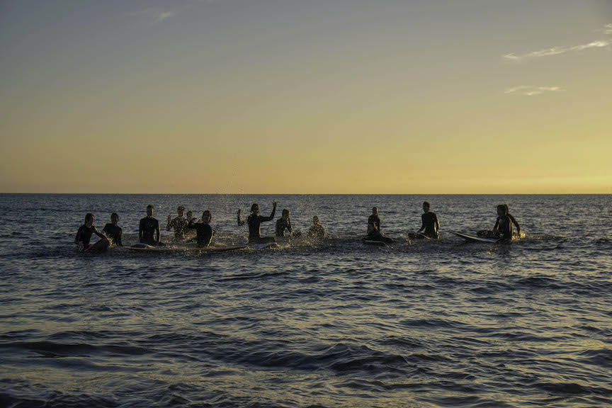 The Surf Club meets up for a sunset session at the Half Moon Bay Jetty. Photo by Alexa Gwyn. 